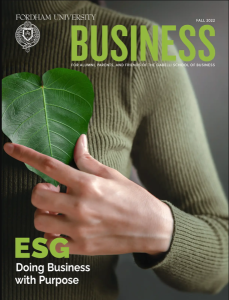Business Magazine cover with person in green sweater holding a leaf.