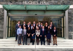 Students in the Fordham University Student Managed Investment Fund program stand outside Hughes Hall.