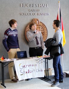 Students talk near the German club table during the Global Business Showcase in February.
